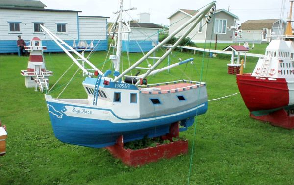 671: A model boat on Lawrence Barry's front lawn in St. Bride's. (2004)